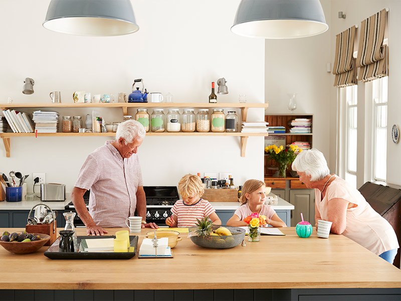 grandparents at kitchen island with grandkids best retirement plan nashville tn