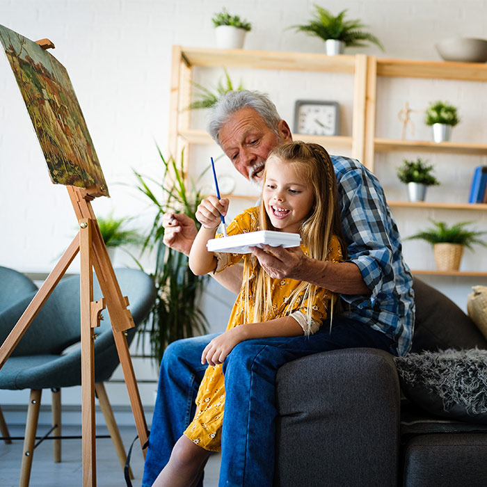 grandfather painting with his granddaughter guaranteed income sparta tn