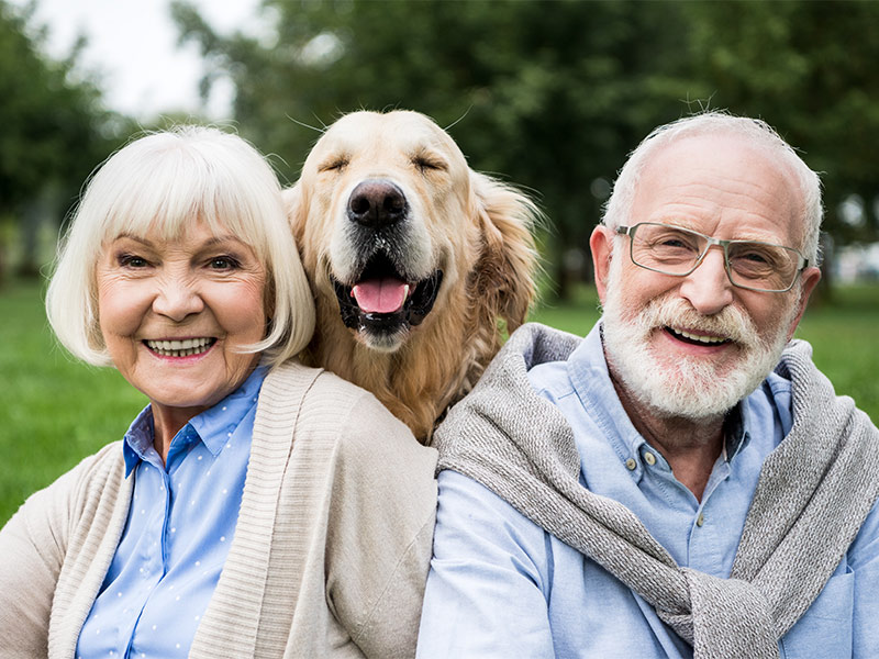 portrait of smiling senior couple with their dog what is a reasonable rate of return on retirement investments sparta tn