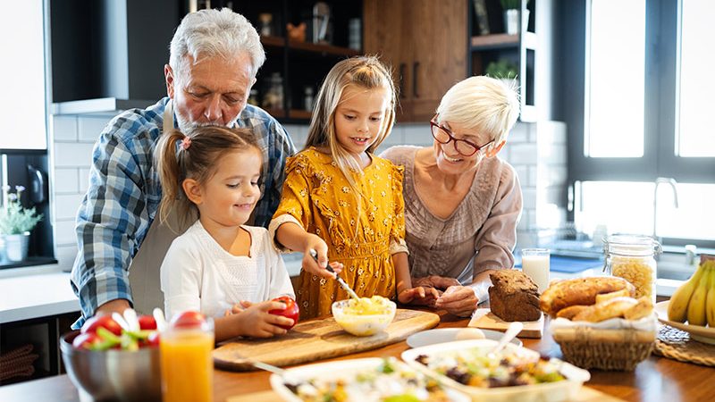 grandparents at kitchen island with their granddaughters tax free retirement income sparta