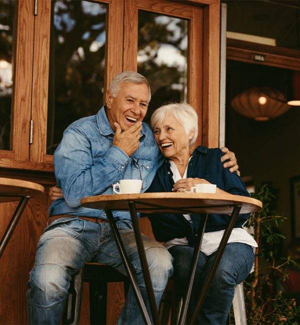 happy-couple-sitting-outside-of-cafe-tax-free-retirement-strategies-sparta-tn